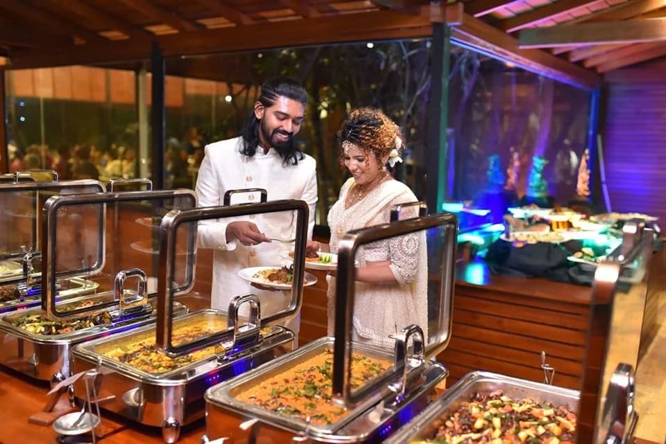 Guests serving themselves at a buffet at Vinrich Lake Resort