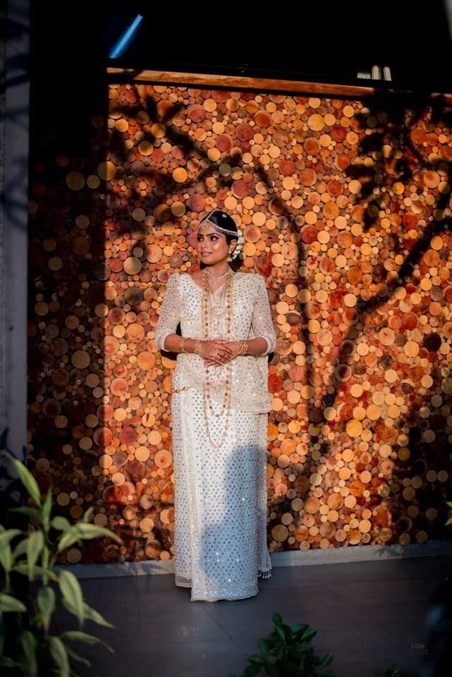 Bride in front of a timber feature wall
