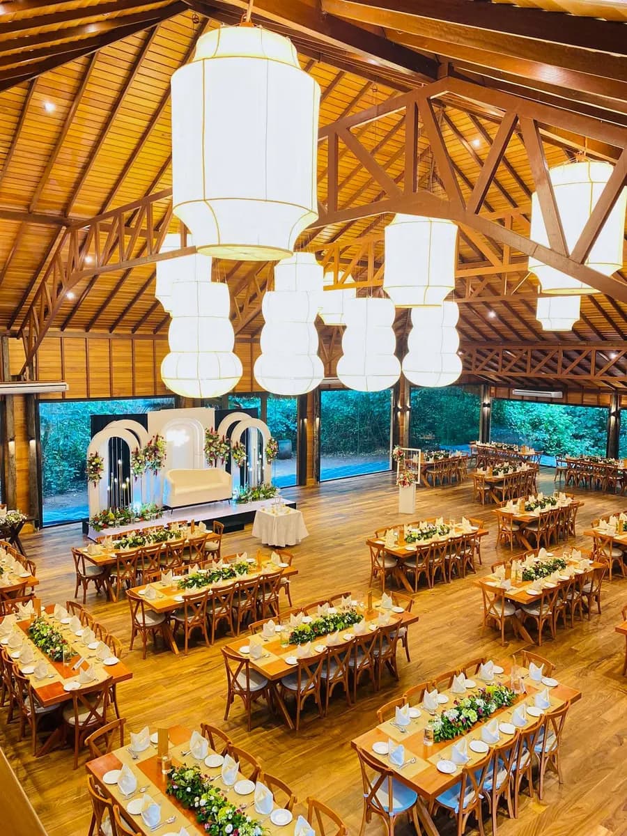 Riverbank Château set for a wedding reception, seen from the mezzanine